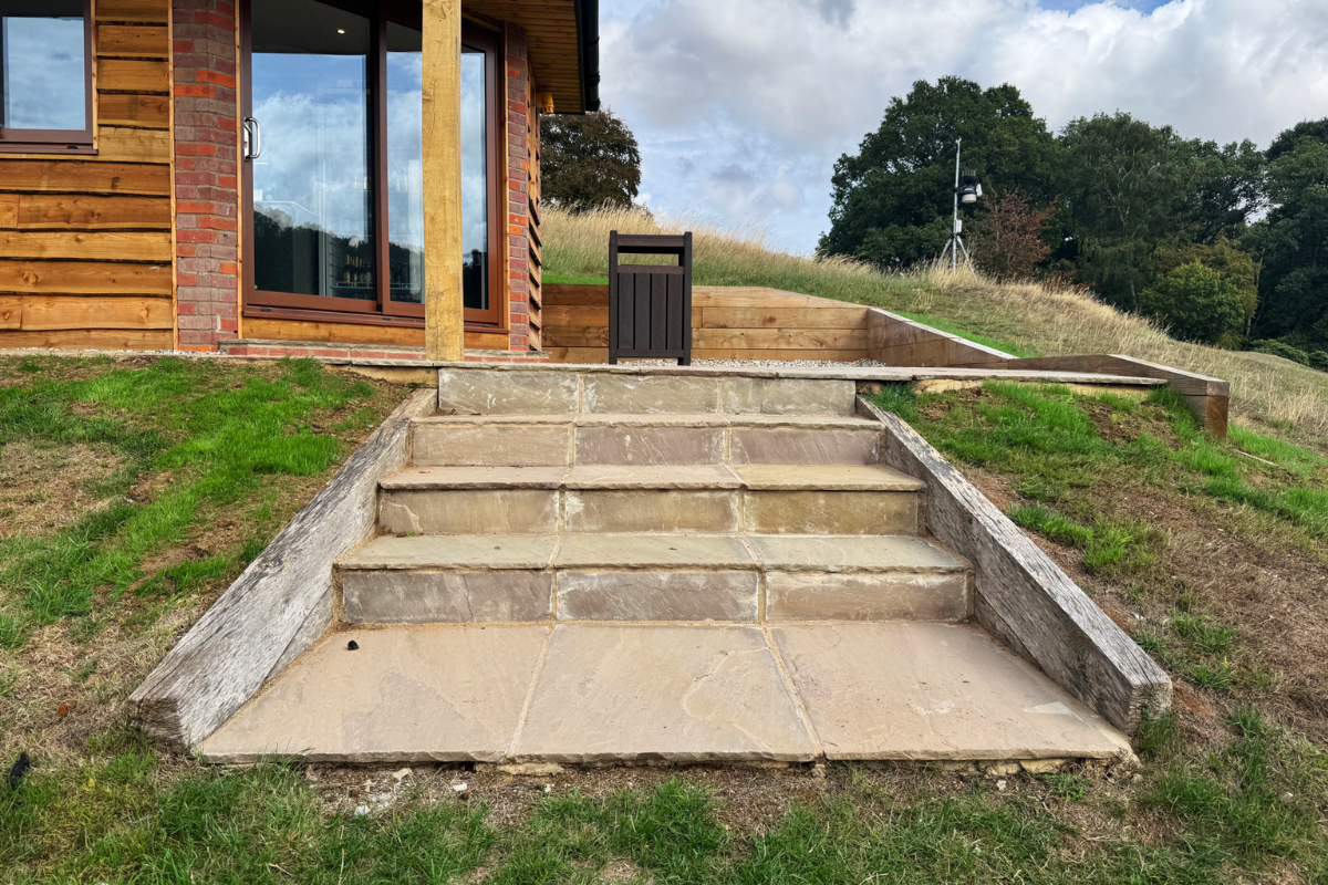 Sandstone steps up to golf hut outbuilding