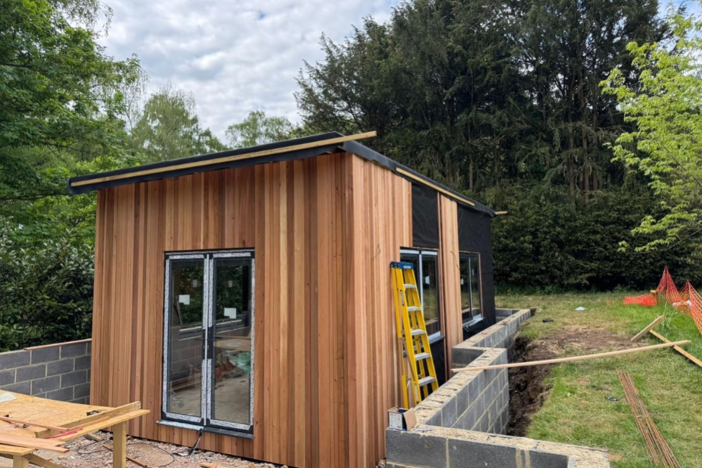 Retaining wall around new garden room, side view